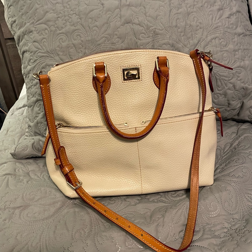 Cream colored Dooney and Burke